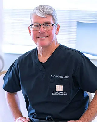 A photo of Dr. Christopher Bates, who is smiling and facing the camera.