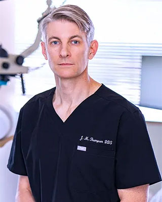 A picture of Dr. Jeremy Thompson, smiling and facing the camera.